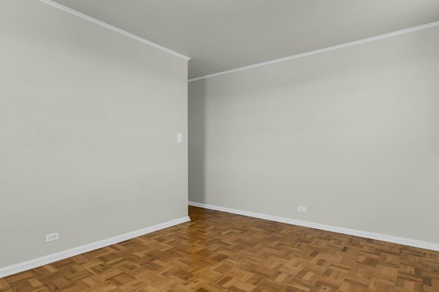 unfurnished room with ornamental molding, radiator heating unit, and baseboards