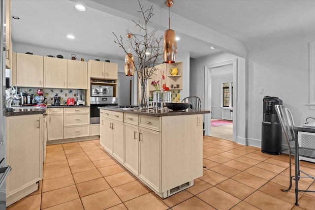 kitchen featuring tasteful backsplash, recessed lighting, decorative light fixtures, and light tile patterned floors