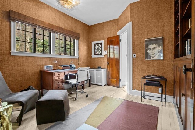 home office featuring light wood finished floors and baseboards