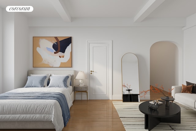 bedroom with arched walkways, visible vents, beamed ceiling, and wood finished floors