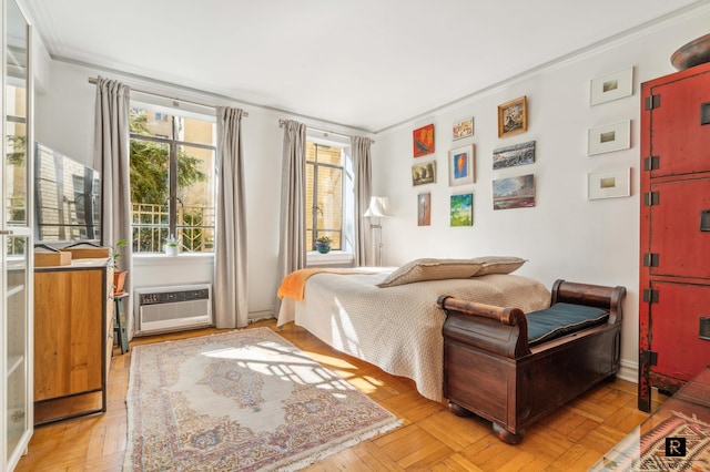 bedroom featuring a wall mounted AC and ornamental molding