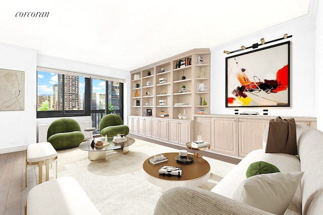 sitting room featuring baseboards, wood finished floors, visible vents, and a city view