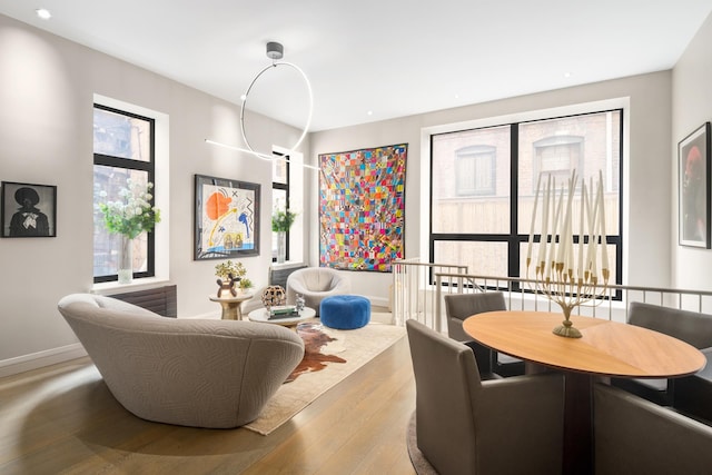 interior space featuring wood-type flooring and baseboards