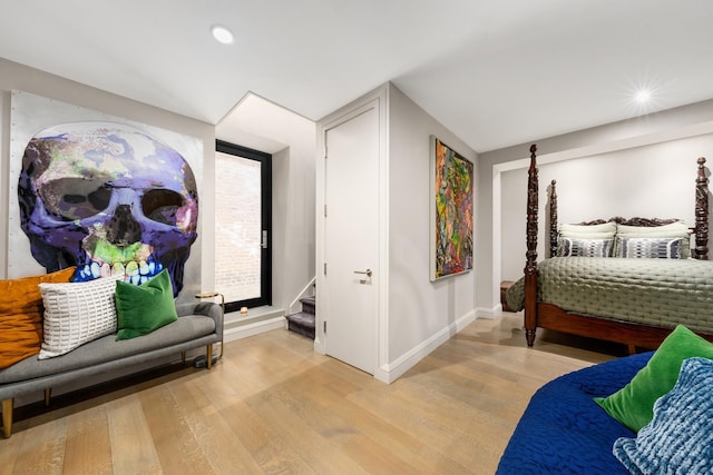 bedroom featuring light wood-type flooring, baseboards, and recessed lighting