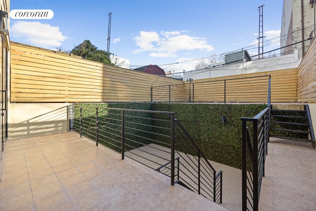 view of patio with fence