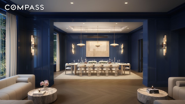 home theater featuring ornamental molding and a tray ceiling