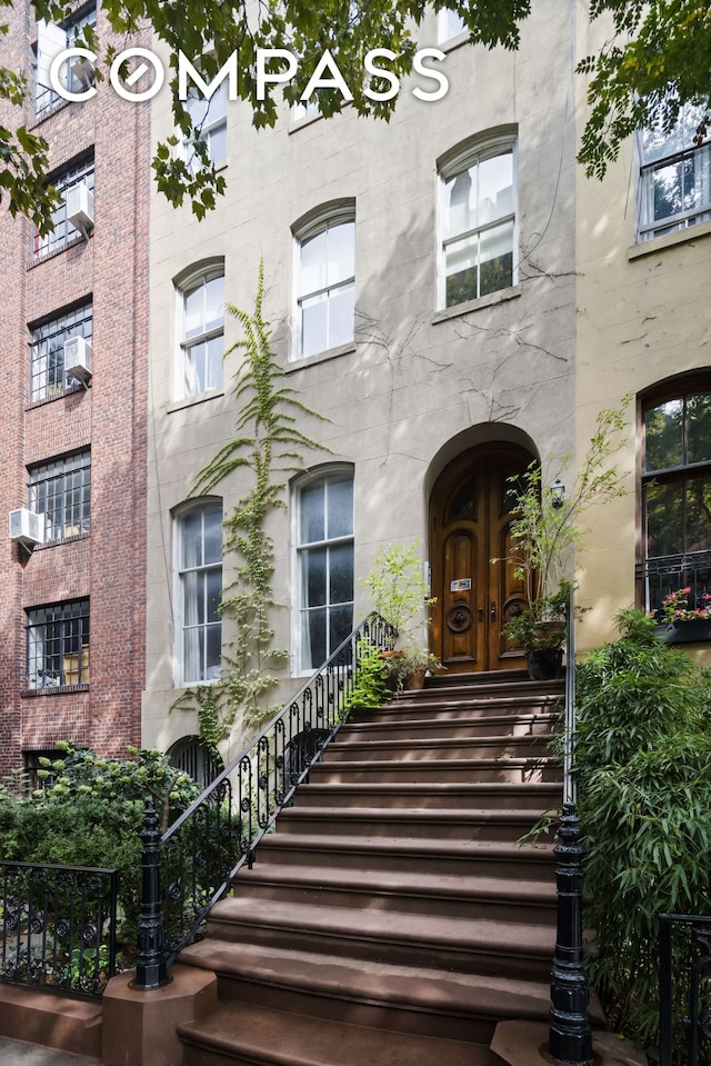 doorway to property featuring cooling unit