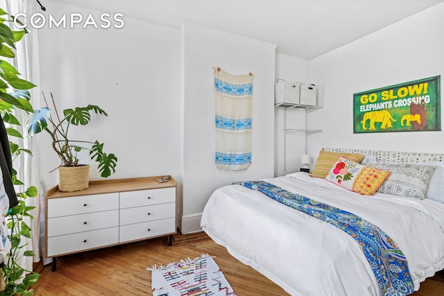 bedroom with wood finished floors