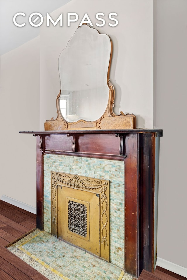 details featuring baseboards and wood finished floors