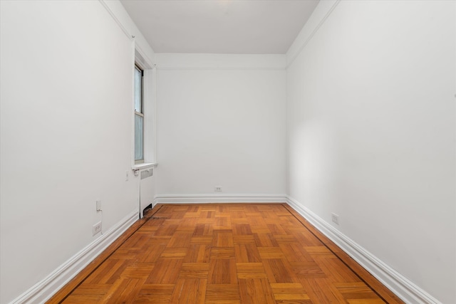 empty room with baseboards