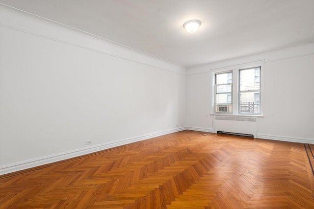 680 W 204th St Unit 3-F, New York City, NY 10034 - empty room featuring radiator heating unit and baseboards