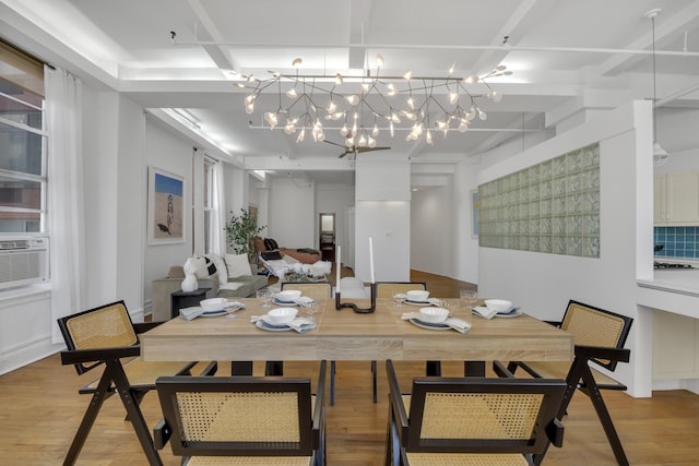 dining space featuring light wood-style floors and cooling unit