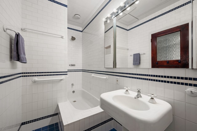 full bath featuring a sink and tile walls