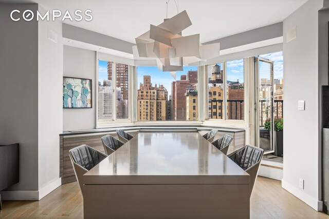 living area with light wood-style flooring and a view of city