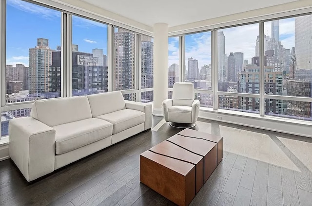 sunroom featuring a view of city