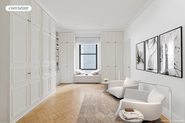 sitting room featuring crown molding