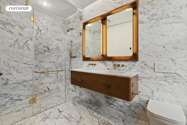 full bath featuring a marble finish shower, toilet, double vanity, stone wall, and a sink