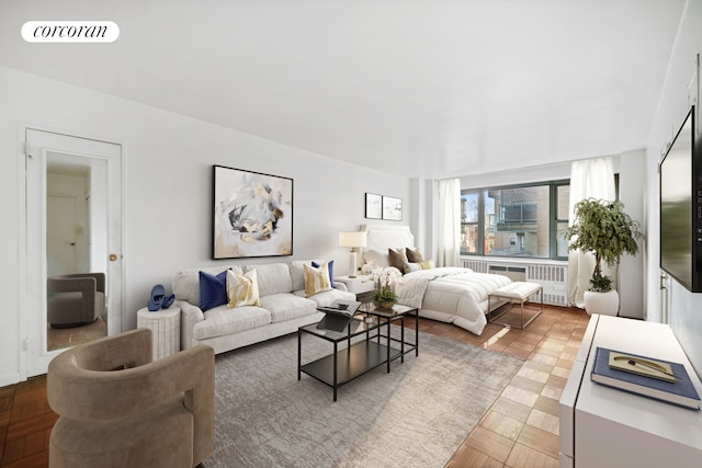 living room with radiator heating unit and visible vents