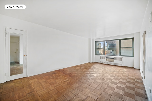 unfurnished living room featuring visible vents and radiator