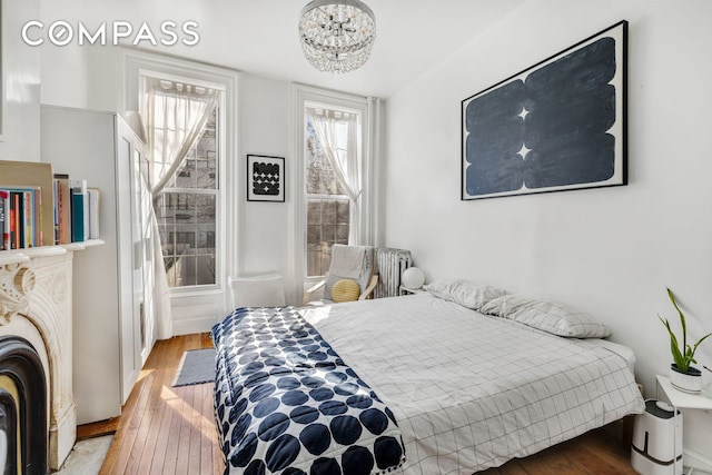 bedroom with hardwood / wood-style floors