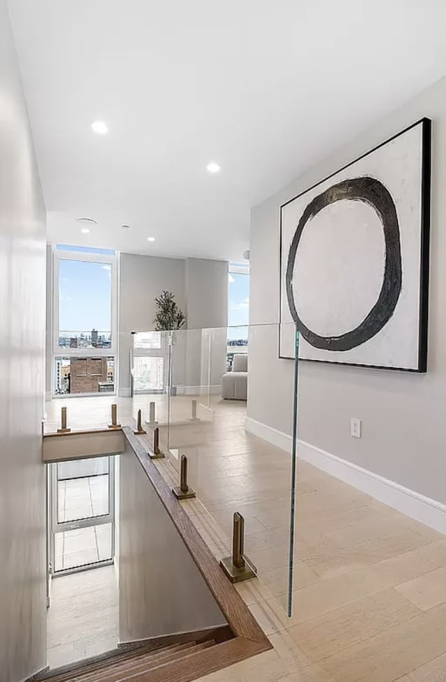 workout area featuring baseboards and wood finished floors