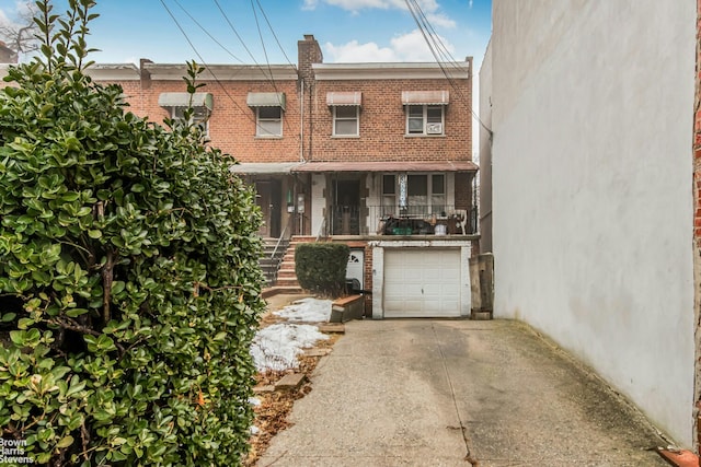 3828A Barnes Ave, New York City, NY 10467 - view of front of home with a garage, driveway, brick siding, and stairs