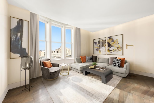 living room featuring parquet floors and baseboards