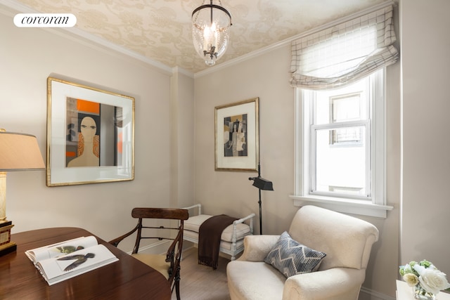 living area with an inviting chandelier, visible vents, and crown molding