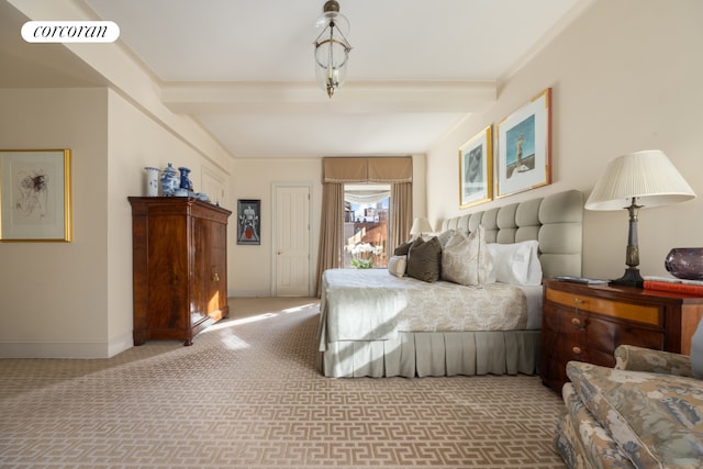 carpeted bedroom with visible vents, beamed ceiling, and baseboards