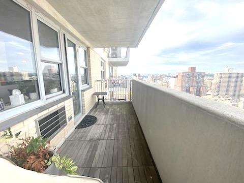 balcony featuring a view of city