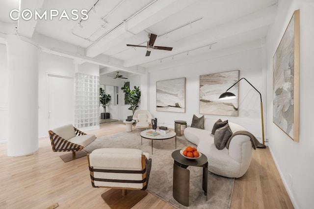 95 Vandam St Unit 2R, New York City, NY 10013 - living area featuring light wood-style flooring, ceiling fan, rail lighting, baseboards, and beamed ceiling