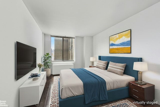 bedroom featuring wood finished floors