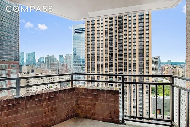 balcony featuring a view of city