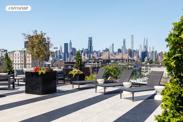 view of patio / terrace with a view of city and visible vents