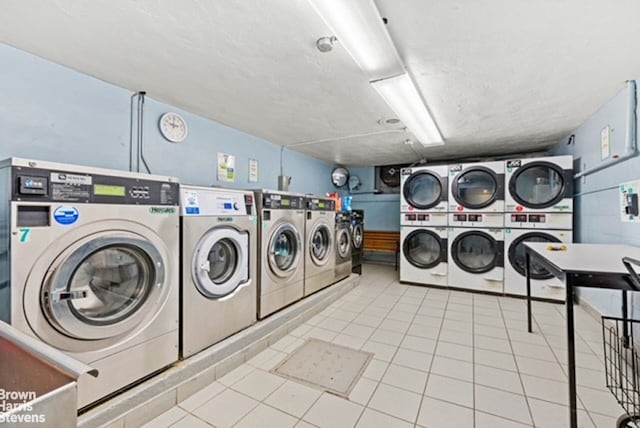 175-45 88th Ave Unit 6M, New York City, NY 11432 - shared laundry with stacked washer and clothes dryer, washer and dryer, and tile patterned floors