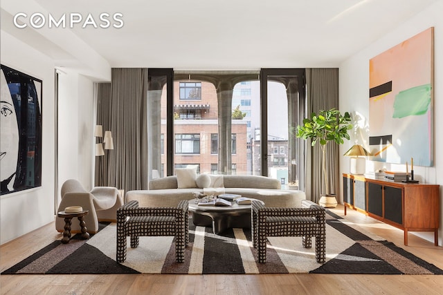 325 W Broadway Unit 7B, New York City, NY 10013 - living room featuring floor to ceiling windows and wood finished floors