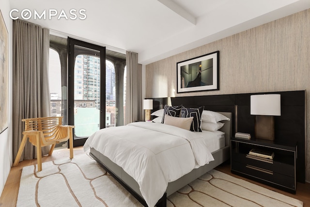 325 W Broadway Unit 7B, New York City, NY 10013 - bedroom with wood finished floors and access to exterior