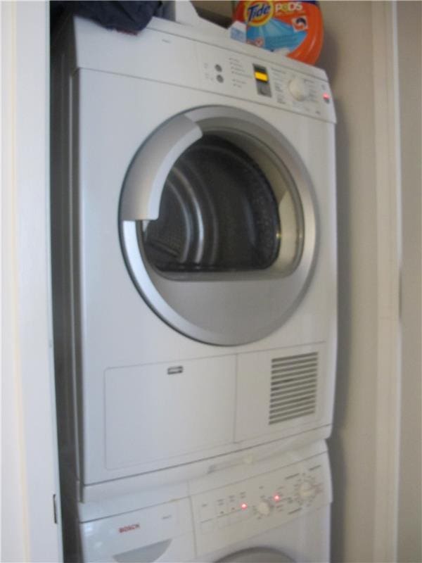 247 W 46th St Unit 1105, New York City, NY 10036 - laundry area with estacked washer and dryer