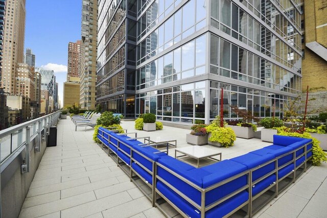 view of community with a city view and outdoor lounge area