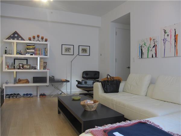 247 W 46th St Unit 1105, New York City, NY 10036 - living room with wood finished floors
