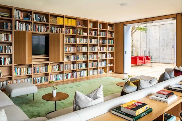 565 Broome St Unit N27B, New York City, NY 10013 - sitting room featuring wall of books