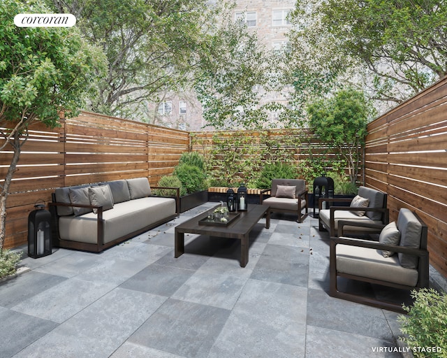 view of patio featuring a fenced backyard and an outdoor living space