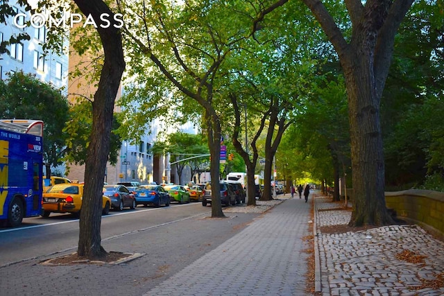8 E 96th St Unit 7C, New York City, NY 10128 - view of asphalt street featuring sidewalks, curbs, and street lighting