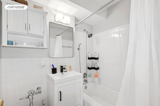 bathroom featuring vanity, tile walls, and shower / tub combo with curtain