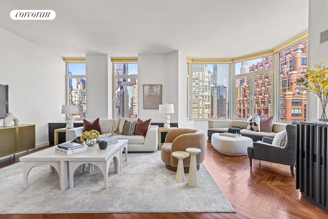 living area featuring visible vents and a city view