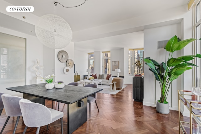 dining room with visible vents, baseboards, and a chandelier