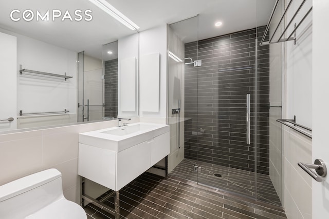 388 Bridge St Unit Ph47A, New York City, NY 11201 - bathroom featuring toilet, vanity, a stall shower, and recessed lighting