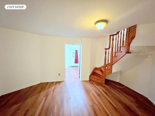 interior space with visible vents, wood finished floors, and stairway