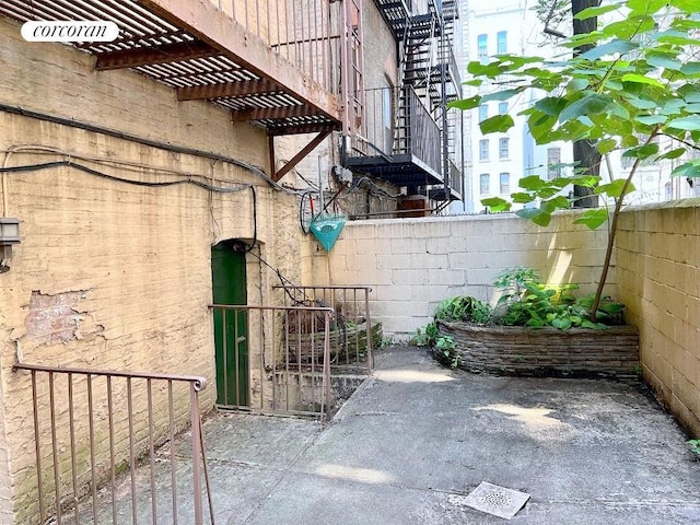 view of property exterior with a pergola, a patio, and fence