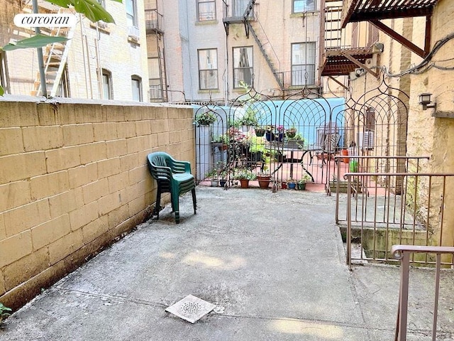 view of patio featuring fence